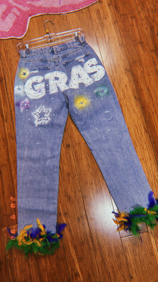 CUSTOM MARDI GRAS GRAFFITI LETTER PRINT DISTRESSED JEANS WITH FEATHER EMBELLISHMENTS