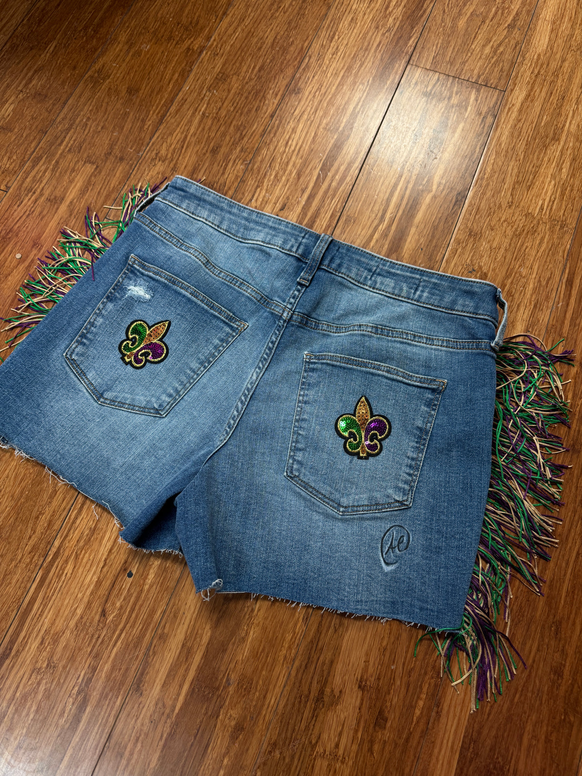 "TRI-FLEUR DE LIS MARDI GRAS FRINGE SHORTS
